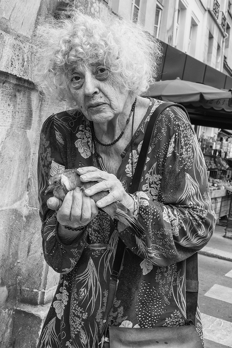 Woman with a young pigeon